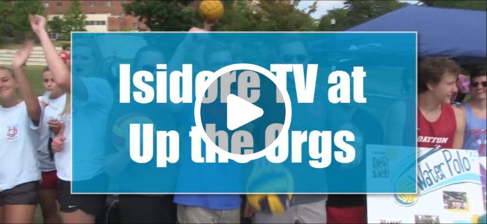 Thumbnail of students at Up the Orgs with an overlay of text: "Isidore TV at Up the Orgs". Click on the picture to play the video.